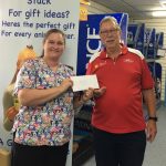 Level 4 Veterinary Nurse Corrina passes on the proceeds from the dog wash to the Mens Shed