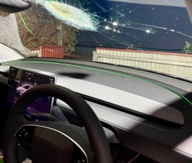 Inside the Tesla covered in glass fragments.