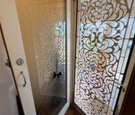 The life saving screen door which stopped her from going through the glass.